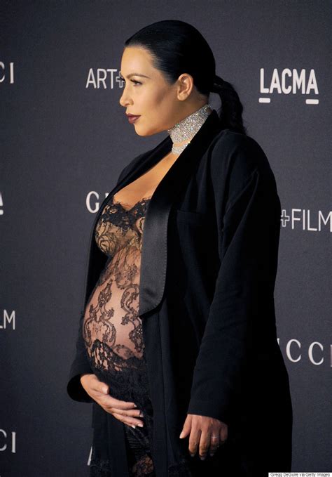 Kim Kardashian Showcases Her Very Pregnant Belly In Sheer Lacy Outfit