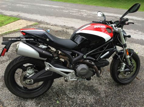 The new monster represents all the essence of ducati in the lightest, most compact and essential form possible. 2010 Ducati Monster 696 M696 Corse Reduced Red White Black ...