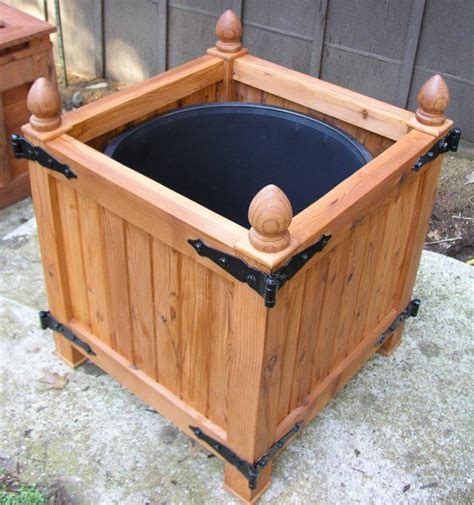 This box planter looks really great for something that is made exclusively out of pallets diy planter box & hose holder. Old World Planter Box, Versailles Orangeries Planter Box ...