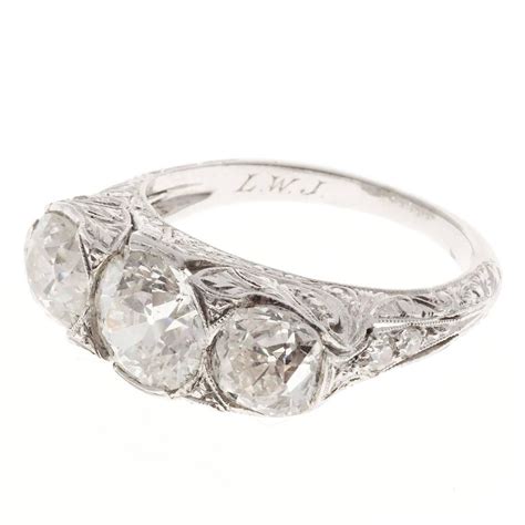 Edwardian Old Mine Diamond Platinum Three Stone Engagement Ring For