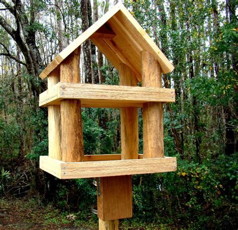 Window bird feeders are almost universally fitted with. Large rustic wood platform bird feeder has 2 levels Use as ...