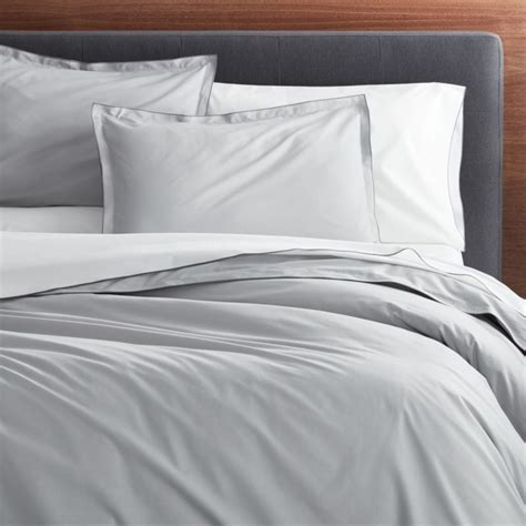 Layer on the fun with our playful audree pom pom quilted bedding. Belo Grey Full/Queen Duvet Cover | Crate and Barrel