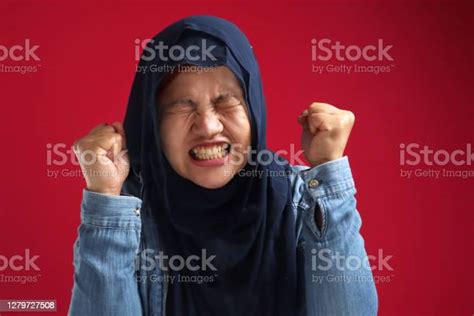 Portrait Of Asian Muslim Lady Wearing Hijab Shows Angry Screaming