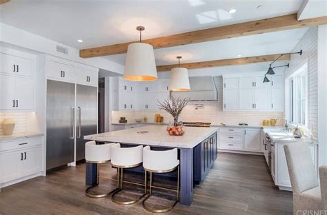 Kitchen decorating and design ideas. Large U-shaped kitchen boasting a massive center island ...