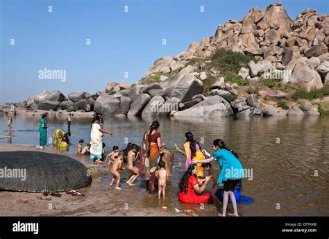 Women Bathing In The Tungabhadra River Hampi Karnataka India Stock