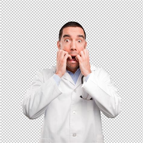 Premium Psd Scared Young Doctor Posing