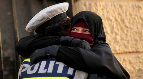 Amidst Protests Against Denmarks Face Veil Ban Photo Of Cop Embracing Woman In Burka Goes