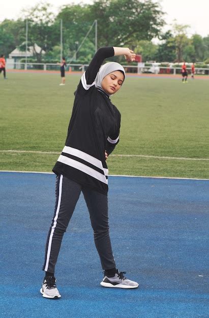 Premium Photo Full Length Of Athlete Wearing Hijab While Exercising