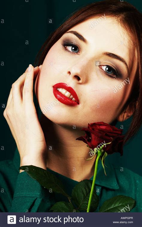 Young Woman With Red Rose Stock Photo Alamy