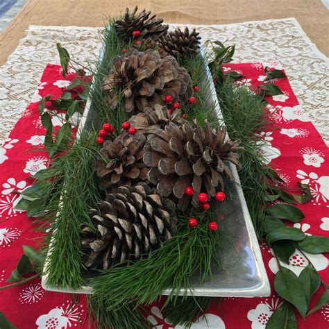 a christmas centrepiece of pine pine cones hessian berries and a touch of lace diy