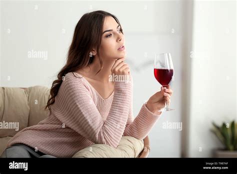 Beautiful Young Woman Drinking Wine At Home Stock Photo Alamy