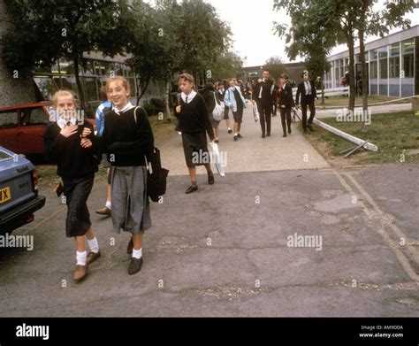 School Children Coming Out Of School On Way Home Stock Photo Alamy