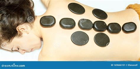 Body Stone Massage Hot Rock Masseur Girl At Salon With Doctor Hands Stock Image Image Of