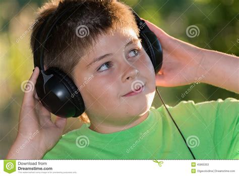 Boy Listening To Music With Headphones In Park Stock Image Image Of