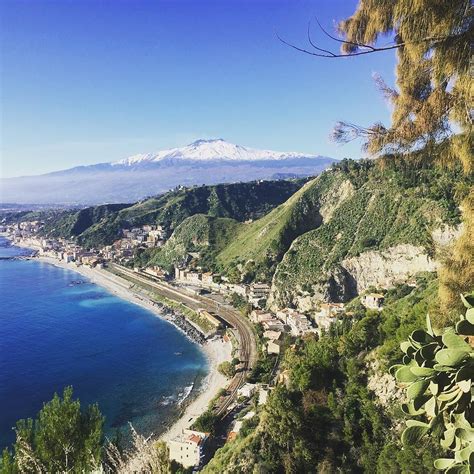 Its impressive size ( more than 3327 meters high with an average basal diameter of 40 km) overlooks the whole region. Looking Out Over Mount Etna, Taormina, Italy Photograph by ...