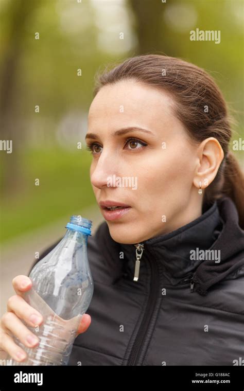 Young Woman Drinking Water After Workout Jogging Caucasian Girl