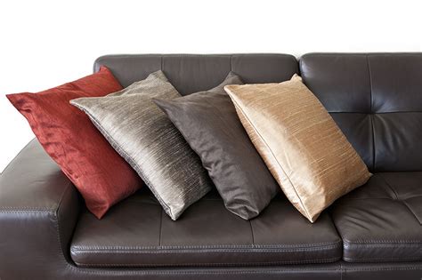Brown Leather Sofa With Grey Pillows Baci Living Room