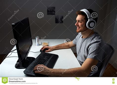 Man In Headset Playing Computer Video Game At Home Stock Photo Image