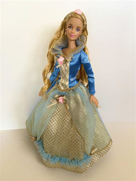 Barbie as Sleeping Beauty 1997. I restored her hair and found her original dress/shoes in my