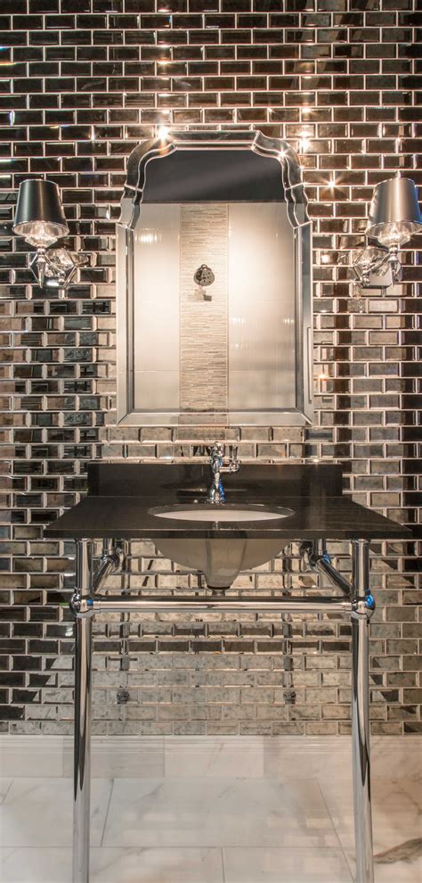 With strip tile, installation is easy using our mirror adhesive. Infused metallic and reflective elements in this bathroom ...
