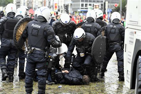 Belgian Riot Police Clash With Protesters Over Working Regulations