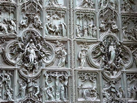 Milan cathedral is 157 meters long and 40,000 people can fit comfortably within. Doors of Milan's Duomo | TravelGumbo