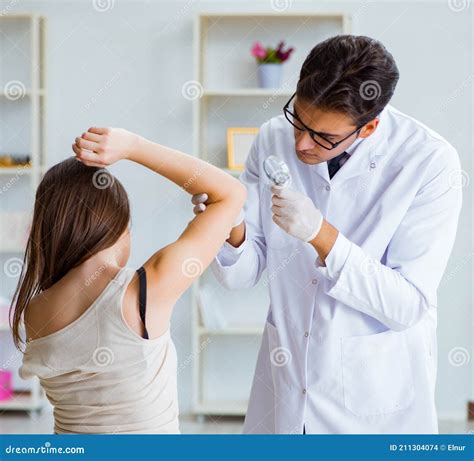 Doctor Examining The Skin Of Female Patient Stock Photo Image Of