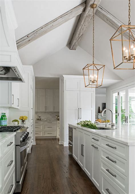 A vaulted ceiling is usually accompanied with windows or skylights, which flood your space with natural light, which is a great advantage. Remodeled White Kitchen with Vaulted Ceiling Beams - Home ...
