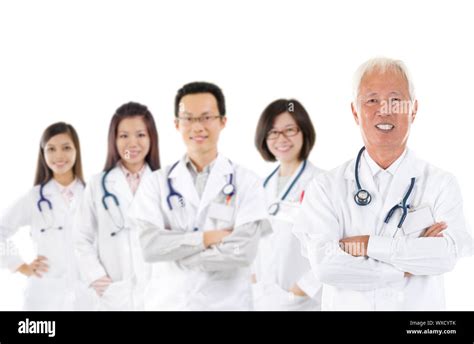 Asian Medical Team Expertise Senior And Mature Doctors Leading Young