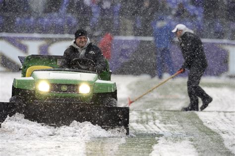 Nfl Players Plow Through Snowy Football Fields