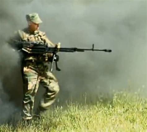 Soldier Wielding A Kord Heavy Machine Gun The Firearm Blogthe Firearm