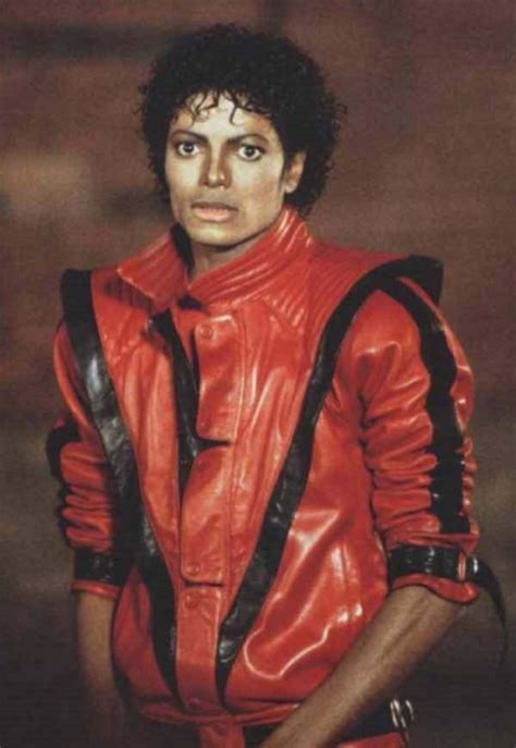 Michael Jackson In Red Leather Jacket With Black Straps On His Chest