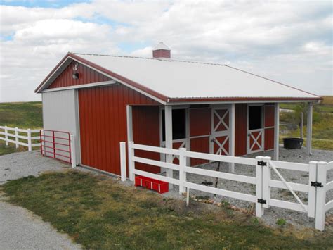 Once the front side of my barn is finally finished, i'm going to paint a flag on mine too!!! Equestrian Buildings and Beautiful Colorado Horse Barns