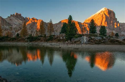 Mountain Rocks And Autumn Trees Reflected In Water Of Limides Lake At