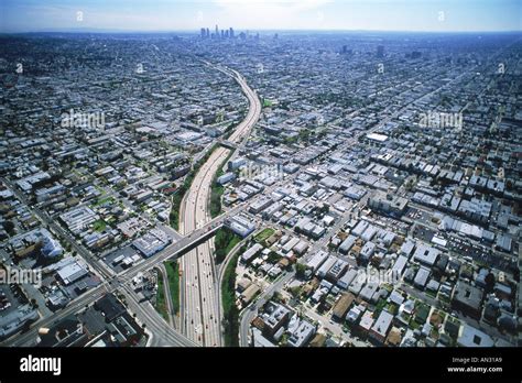 Aerial View Of Freeway Cutting Through Los Angeles Urban Sprawl Stock