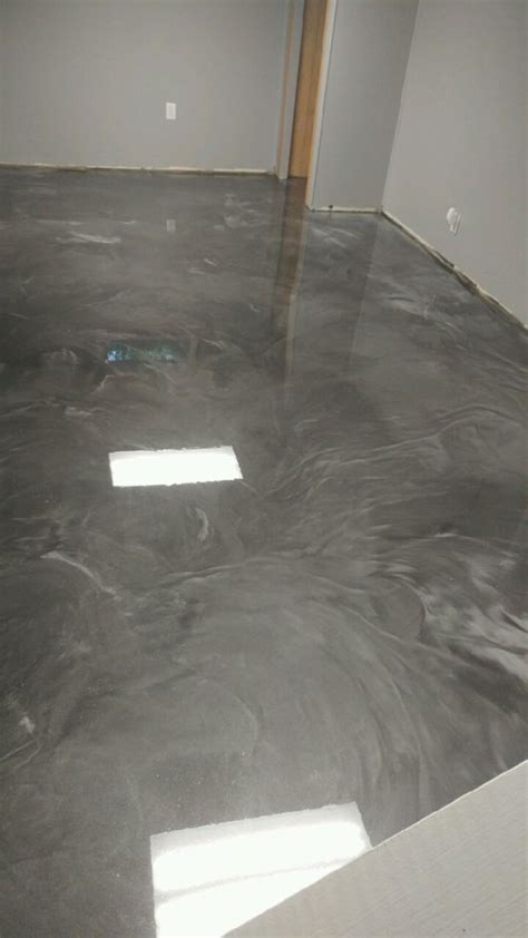 There are quite a few reasons why many families are making the. Metallic epoxy floor silver and charcoal! | Metallic epoxy floor, Epoxy floor basement, Epoxy floor