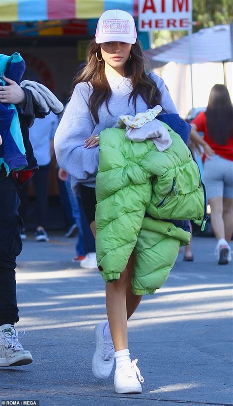 The singer, 33, recorded a. Madison Beer cuts a casual figure in baseball cap and ...
