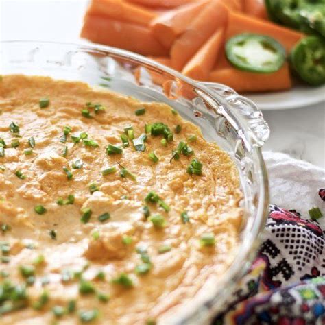 This buffalo chicken dip recipe is everyone's favorite game day or party appetizer! A buffalo chicken wing dip that's warm, creamy, and cheesy ...