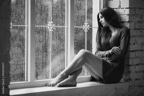 Beautiful Young Woman Sitting Alone Near Window With Rain Drops Sexy And Sad Girl With Long