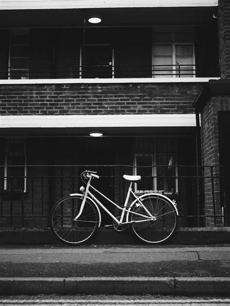 bicycle parked near metal railings photo free bike image on unsplash