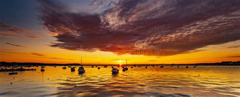 Spectacular Sunset Over Boats At Sandbanks Poole Harbour Dorset Stock