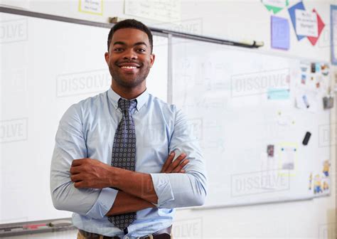 Portrait Of Confident African American Male Teacher In Class Stock