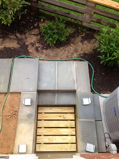 These deck tiles snap together in a flash and they allow rain water to run through. DIY Deck Stairs