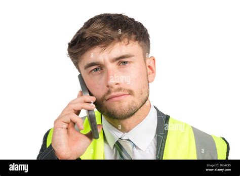 Portrait Of A Serious Business Man In A Suit With A Hi Vis Vest Using