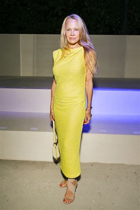 Pamela Anderson Attends Paris Fashion Week Runway Show Makeup Free