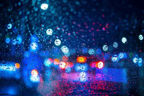 Rain Drops On Window With Road Light Bokeh Raining Season Stock Photo