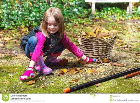 Definition of picked up in the idioms dictionary. Girl Picking Up Autumn Leaves Royalty Free Stock ...