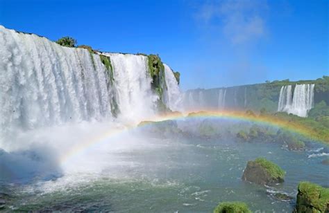 Premium Photo Incredible Rainbow Over The Powerful Iguazu Falls At
