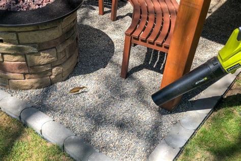 Use a leaf blower to push as much debris out of the rocks as possible.; How to Make a Pea Gravel Patio in a Weekend in 2020 | Pea ...