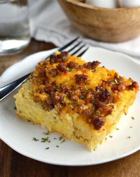 This hash brown egg casserole is full of ham, veggies and cheese, all baked to perfection. Overnight Hash Brown Casserole - Friday is Cake Night